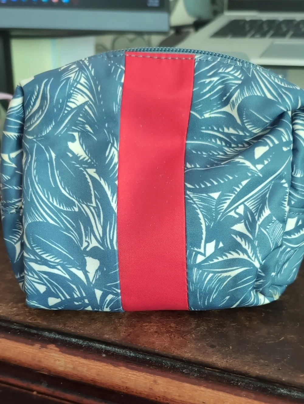 Tory Burch Navy Floral Cosmetic Pouch with Red Stripe.
